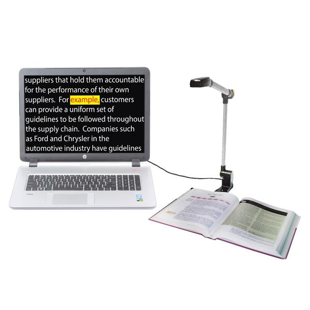 Laptop with camera scanning an open book; OCR text enlarged on screen.