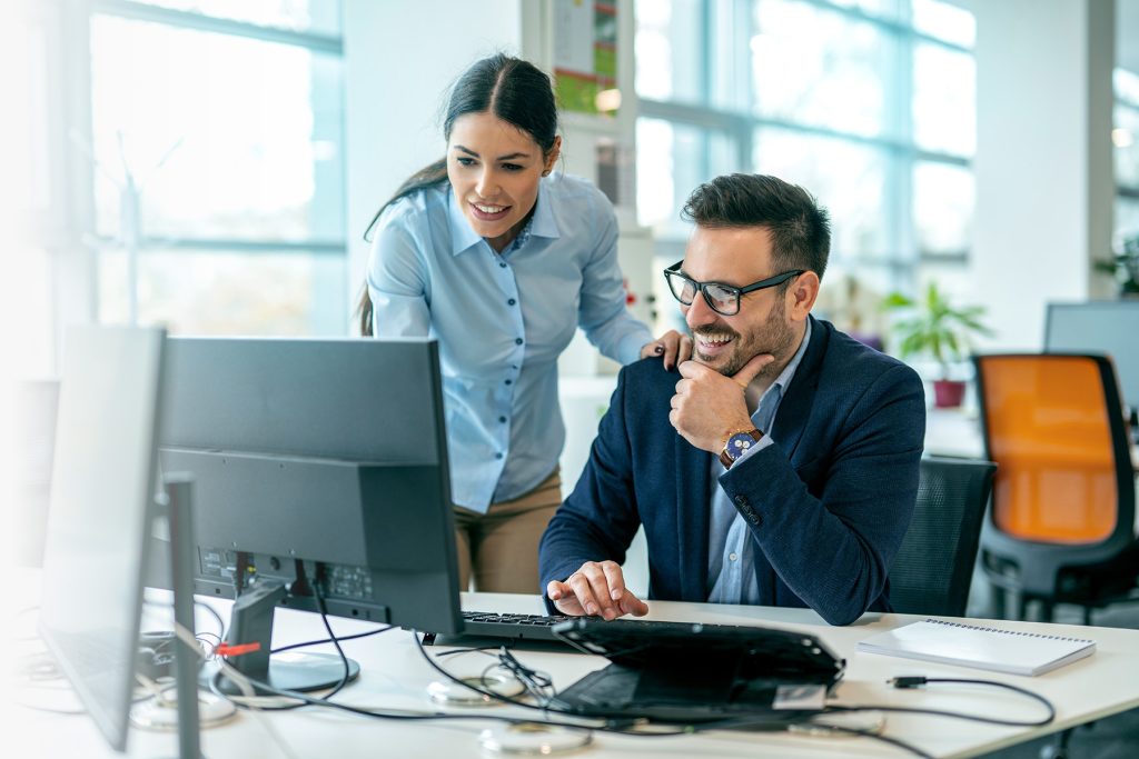 2 People looking at a computer