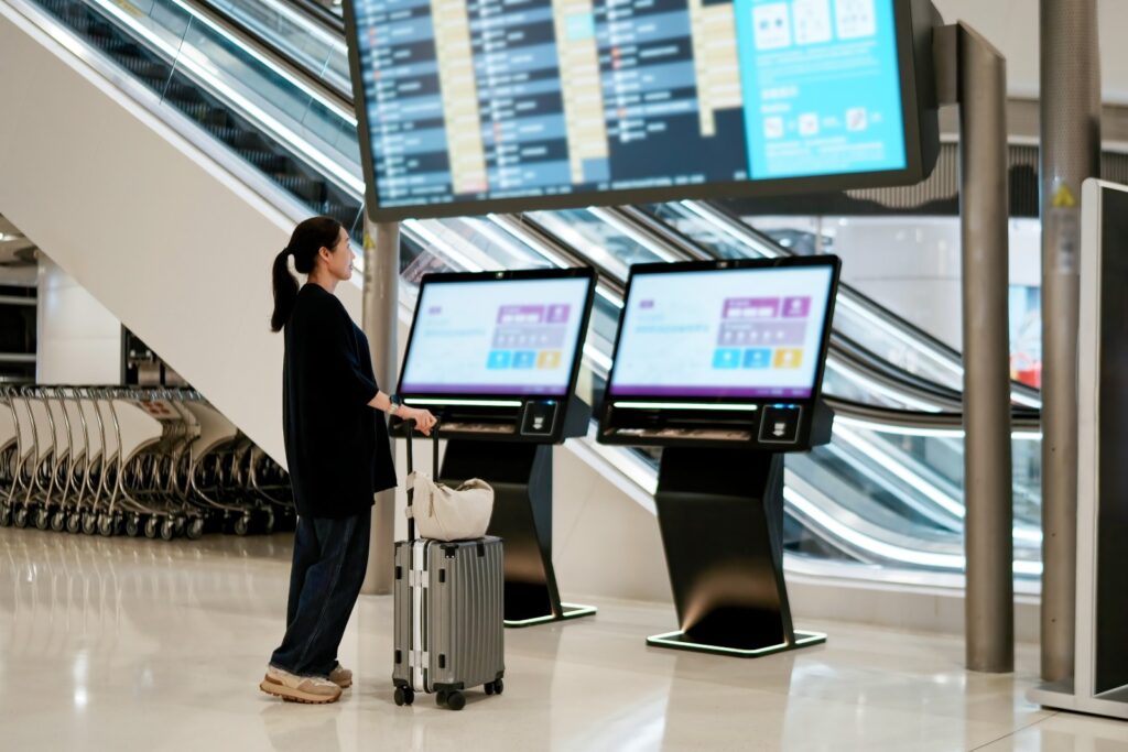 Woman at an airline kiosk